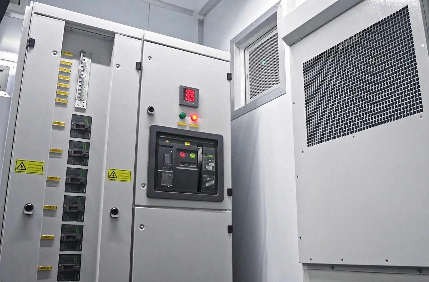 Electrical panel interior with breakers and controller