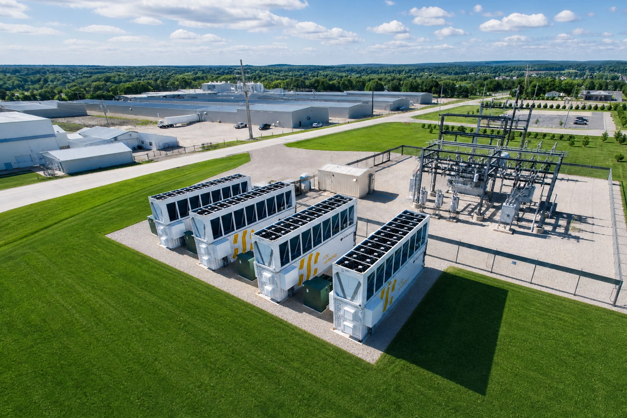 Four air-cooled containers running on the Simple Mining site, dry coolers open above each