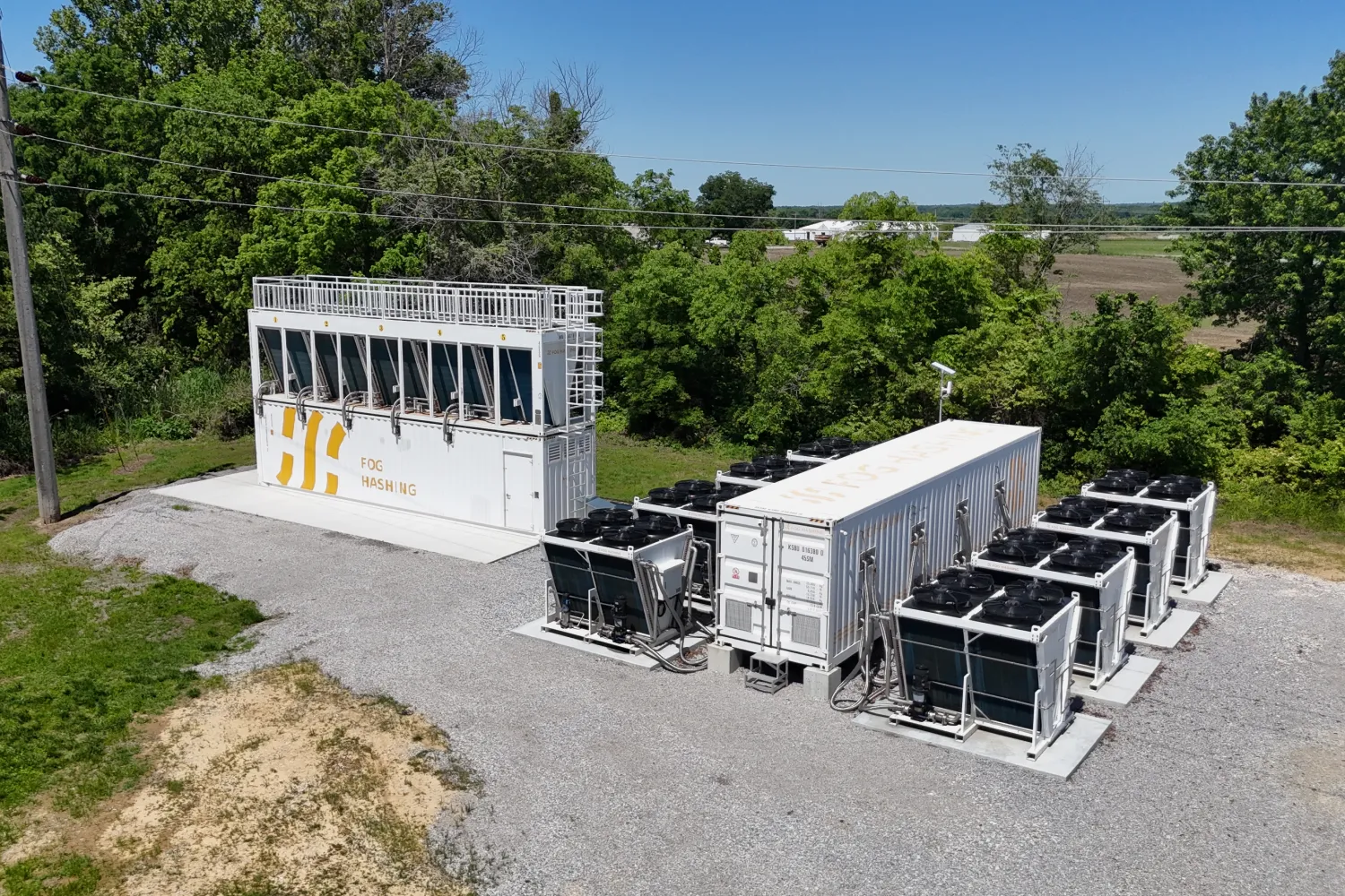 The two Fog Hashing BC40 immersion containers on the Missouri site, dry coolers alongside, seen from the air