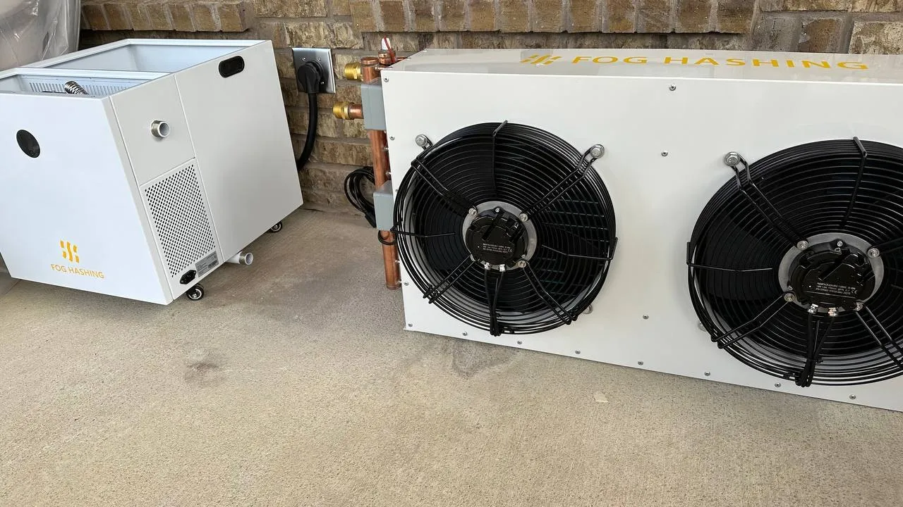 A tank and its dry cooler installed against an outside wall