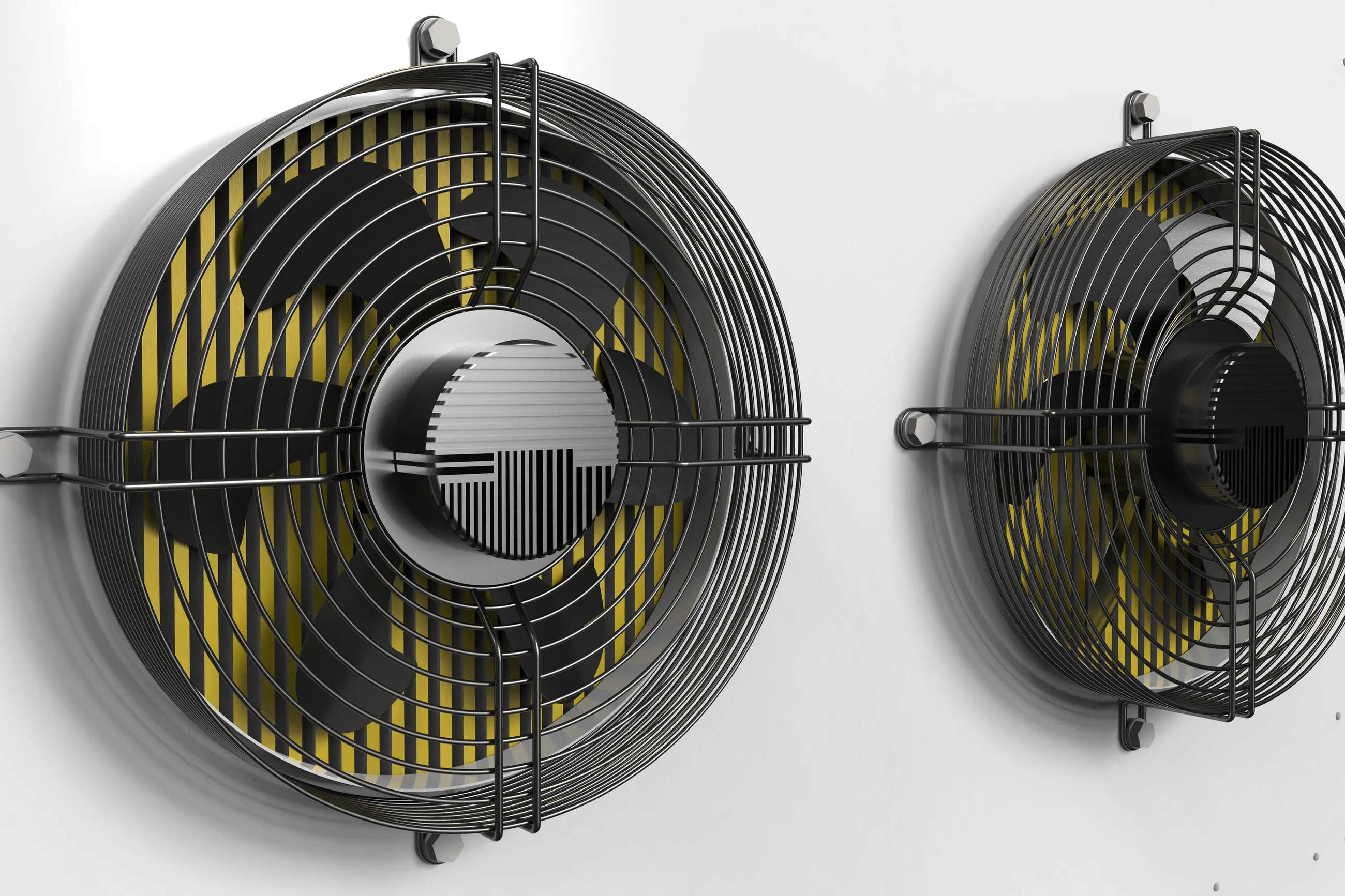 Two EC fans in close-up, yellow blades behind the guard