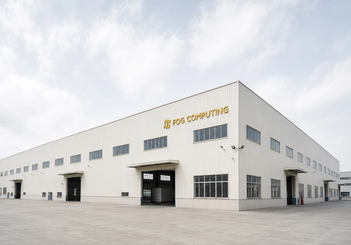 A Fog Computing plant from the yard, wordmark across the long elevation above the loading bays