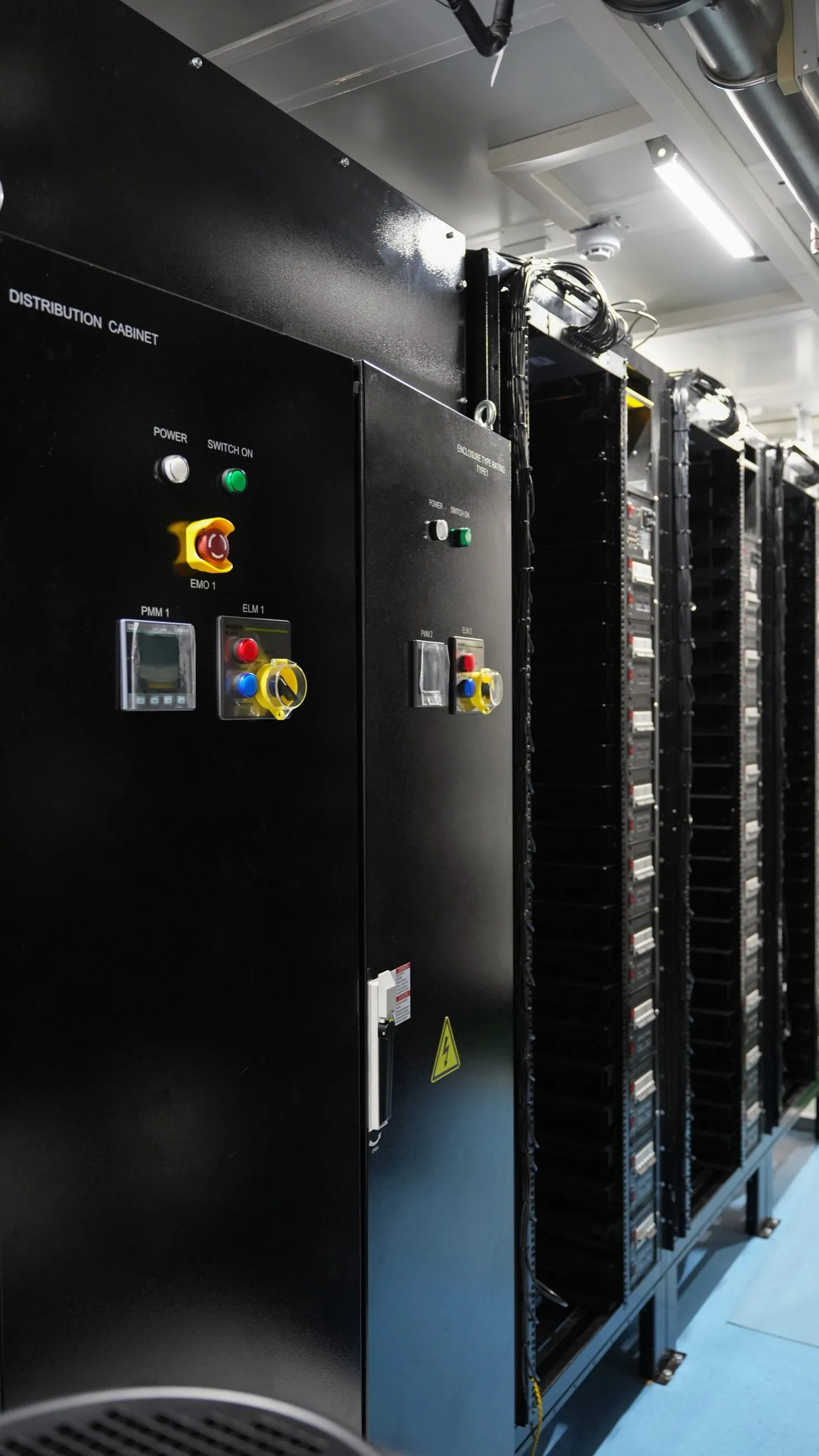 Container interior: the distribution cabinet, with hydro-cooled racks running back from it