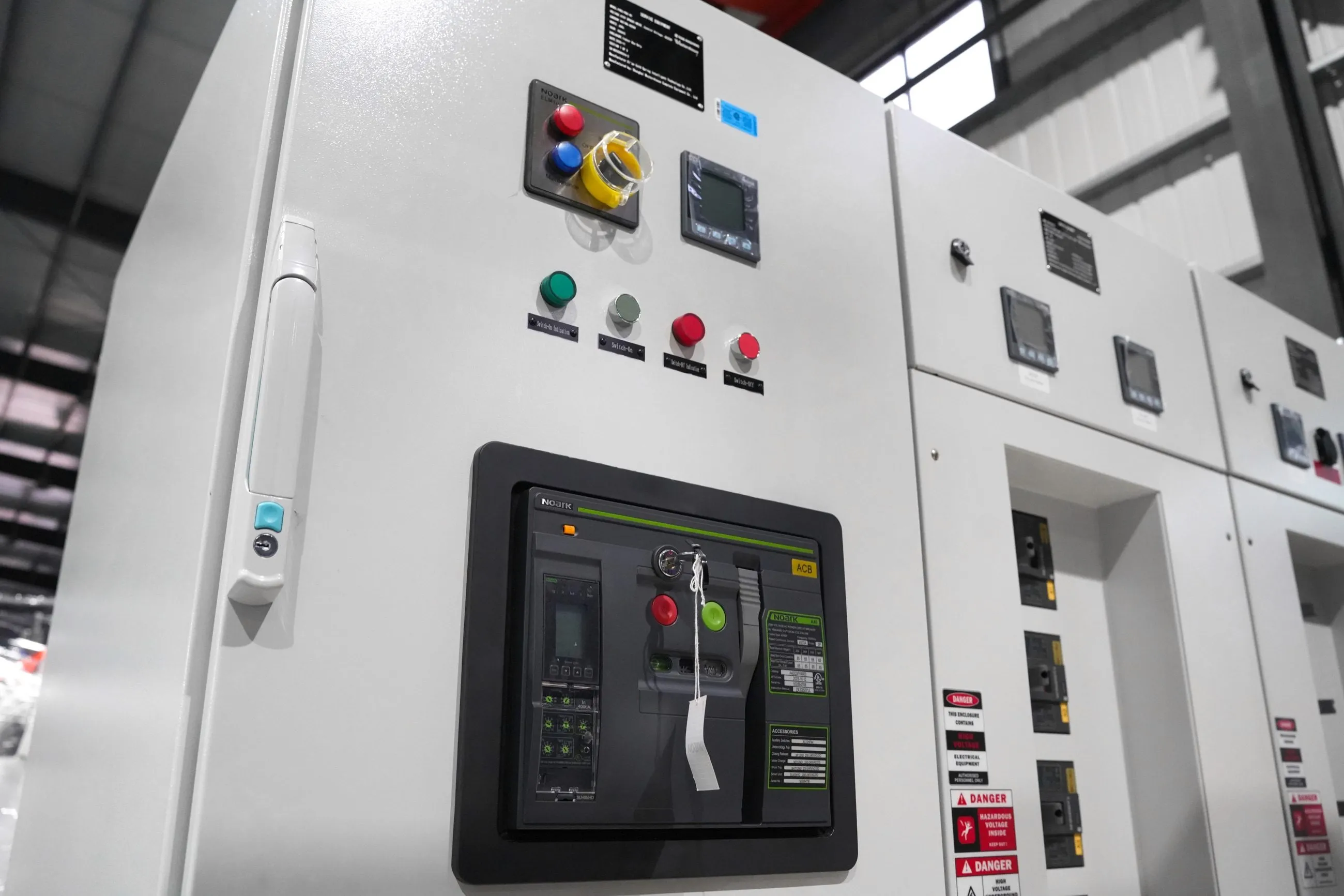 Power cabinet controls: breaker panel and monitoring screen