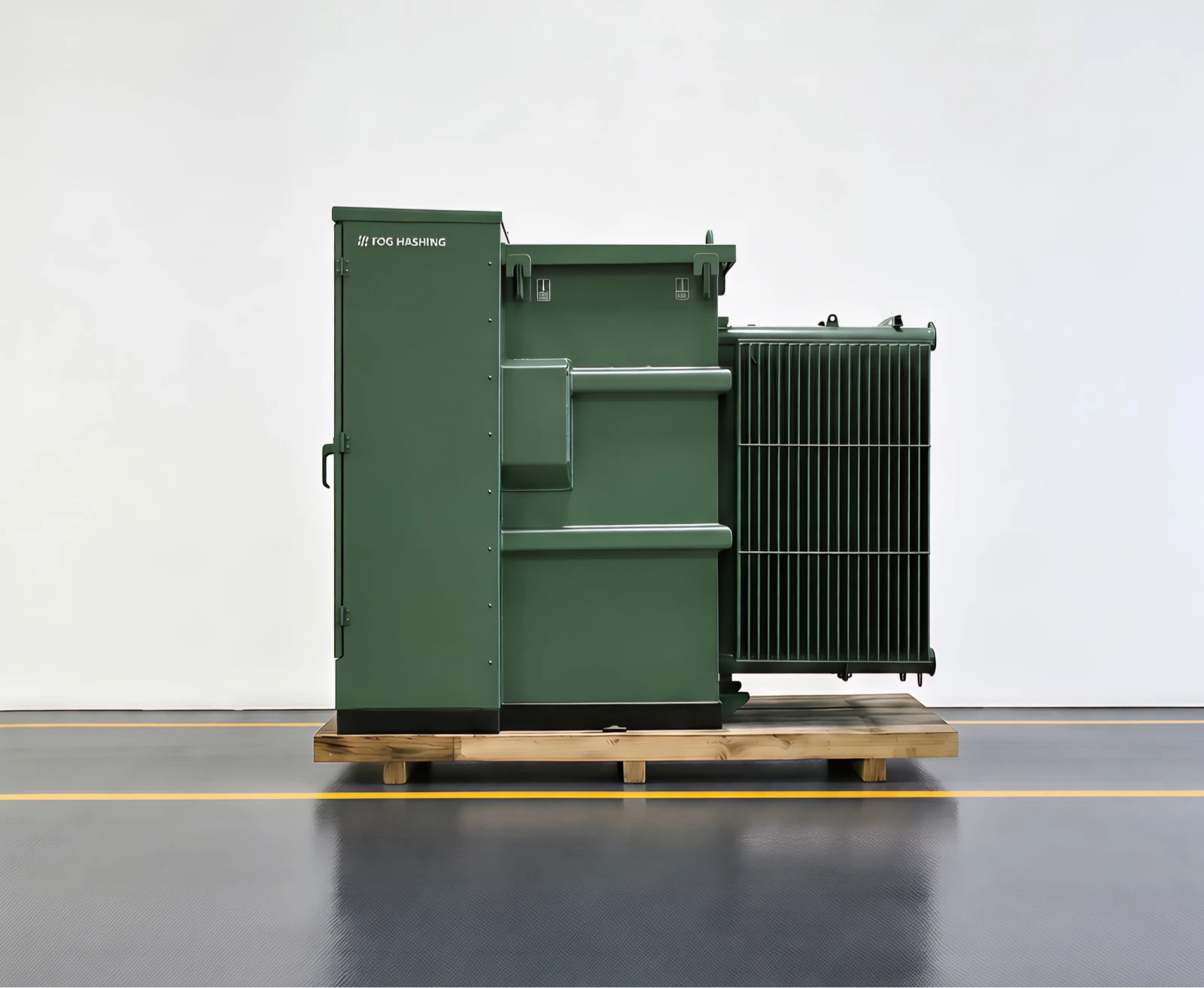 A green Fog Hashing pad-mount transformer palletized on the factory floor