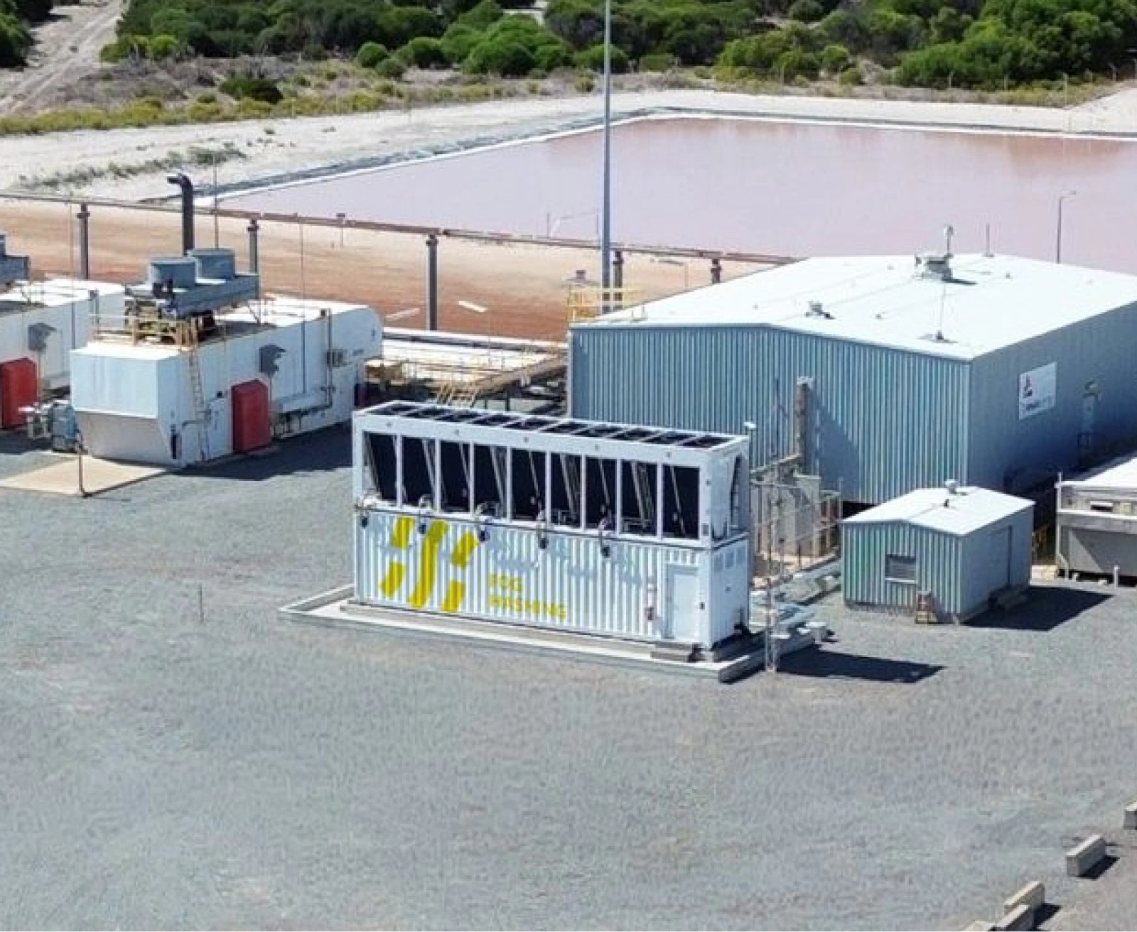 Fog Hashing hydro-cooling container running beside the plant building on an industrial site